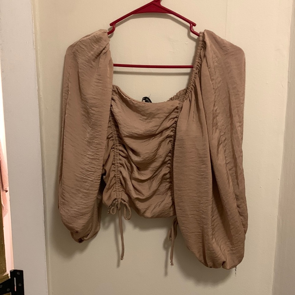 Good condition. No signs of tearing. Ties at the bottom. Cropped.